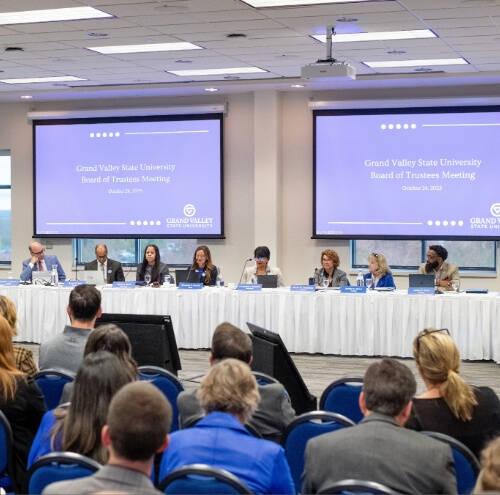 people seated at board meeting